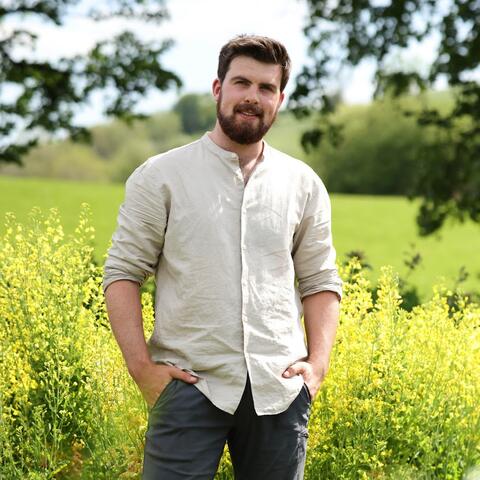 man standing in field